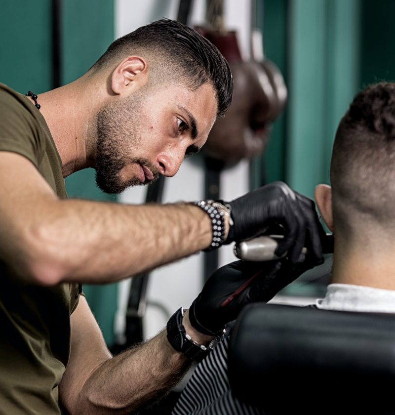 barber-trims-mustache-of-dark-haired-man-at-a-barbershop.jpg barber-trims-mustache-of-dark-haired-man-at-a-barbershop.jpg