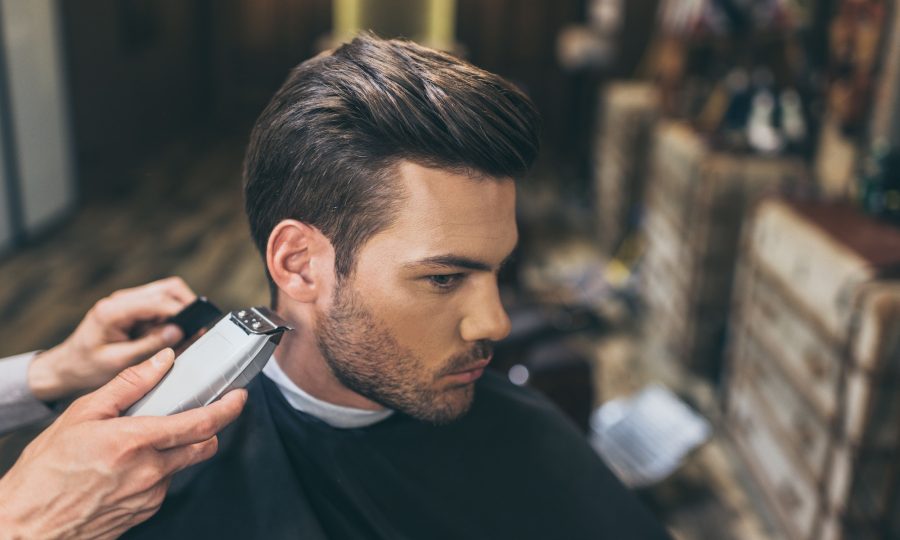 male-barber-cutting-hair-of-customer-in-barber-shop.jpg male-barber-cutting-hair-of-customer-in-barber-shop.jpg